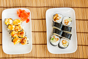 sushi, chopsticks and soy sauce bowl