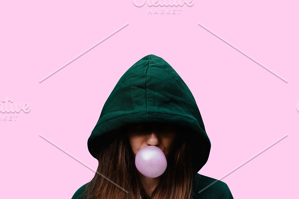girl inflates chewing gum. bubble of