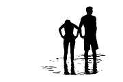 Silhouette of couple in the sea