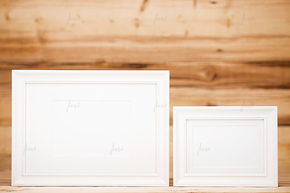 White frames on wood background in Print Mockups - product preview 1