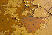 Texture of cracked yellow paint
